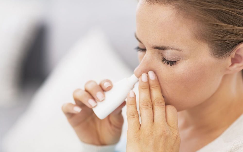 Person using an inhaler