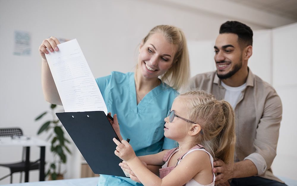 Nurse with a family during a checkup
